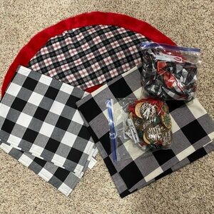 Black, white & red plaid tree skirt and assorted Christmas decorations